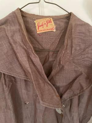 Two women’s dresses and aprons