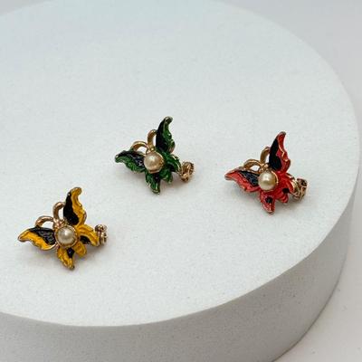 LOT 569J: 3 Mini Goldtone Enamel & Faux Pearl Butterfly Scatter Pins, Vintage Goldtone Pave Crystal Violin Brooch & Circle Leaf...