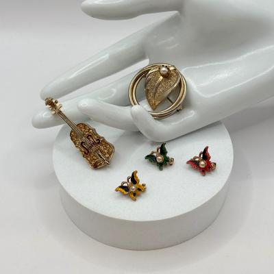 LOT 569J: 3 Mini Goldtone Enamel & Faux Pearl Butterfly Scatter Pins, Vintage Goldtone Pave Crystal Violin Brooch & Circle Leaf...