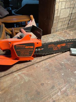 Electric chainsaw and portable vice bench
