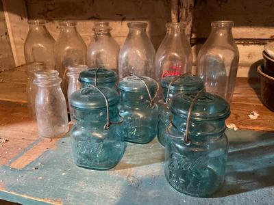 Milk bottles, and blue ball canning jars with lids