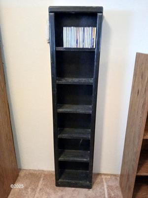 Tall Narrow Black Media Shelf – CD/DVD Storage Tower with an assortment of cd's