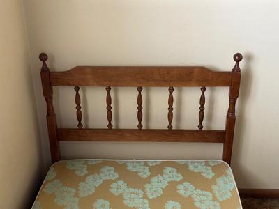 TWIN BED BOX SPRING WITH HEADBOARD AND METAL FRAME ON CASTERS