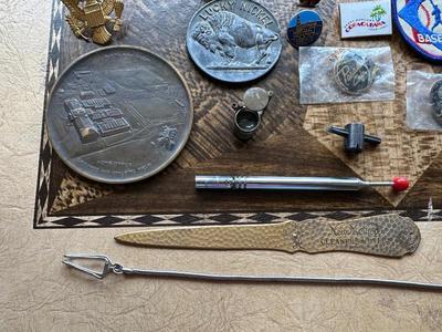 NICE ASSORTMENT OF PATCHES, PINS, VINTAGE MAGNIFYING GLASS LOUPE, METAL COINS AND MORE