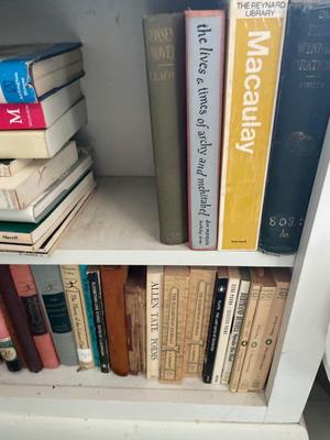 Thee shelves assorted books