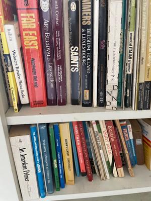 Three shelves assorted books