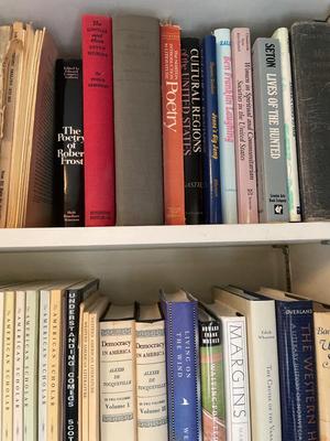 Three shelves assorted books