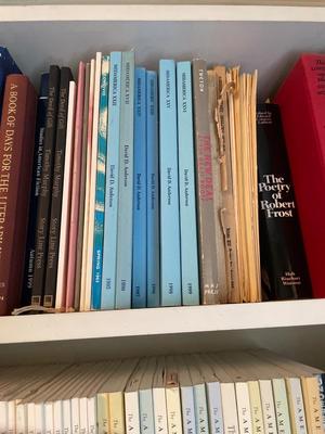 Three shelves assorted books