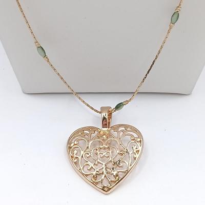 LOT 6: Collection of Gold-Tone Necklaces, Earrings and Sarah Coventry Pendant