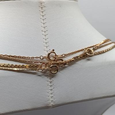 LOT 6: Collection of Gold-Tone Necklaces, Earrings and Sarah Coventry Pendant