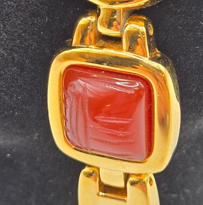 LOT 25: Gold-tone Cuff Bracelet, Gold-tone Spring Open Bracelet w/ Amber Colored Gems, and Kenneth Jay Lane Scarab Gemstone Watch