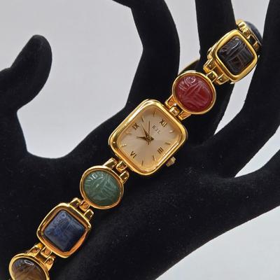 LOT 25: Gold-tone Cuff Bracelet, Gold-tone Spring Open Bracelet w/ Amber Colored Gems, and Kenneth Jay Lane Scarab Gemstone Watch