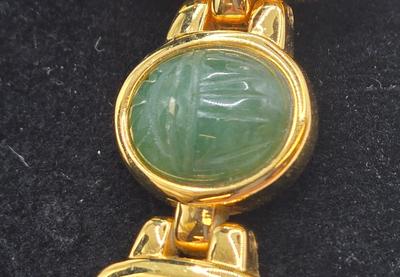 LOT 25: Gold-tone Cuff Bracelet, Gold-tone Spring Open Bracelet w/ Amber Colored Gems, and Kenneth Jay Lane Scarab Gemstone Watch