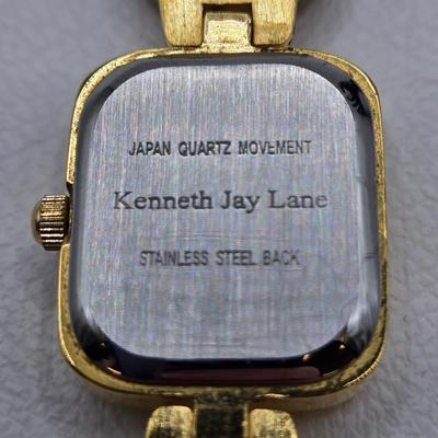 LOT 25: Gold-tone Cuff Bracelet, Gold-tone Spring Open Bracelet w/ Amber Colored Gems, and Kenneth Jay Lane Scarab Gemstone Watch