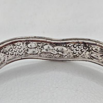 LOT 27: Three Silver-tone Cuff Bracelets and one Magnetic Closure Braided Rope-like Bracelet