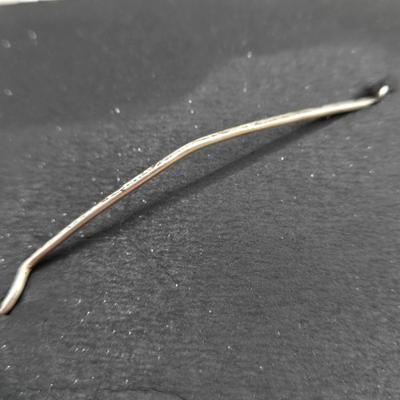 LOT 29: Three Hand-Crafted Metal Hair Accessories