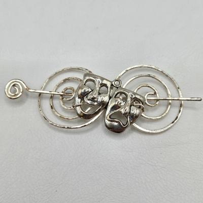 LOT 29: Three Hand-Crafted Metal Hair Accessories