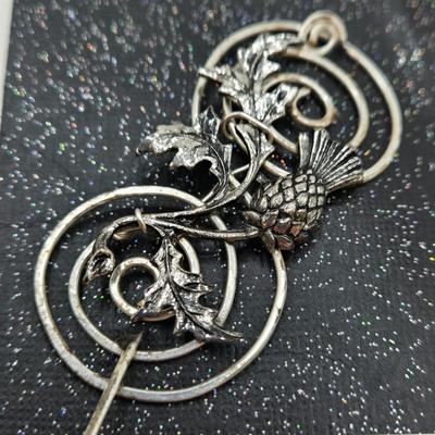 LOT 29: Three Hand-Crafted Metal Hair Accessories