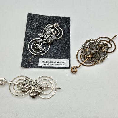 LOT 29: Three Hand-Crafted Metal Hair Accessories