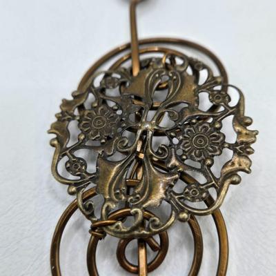 LOT 29: Three Hand-Crafted Metal Hair Accessories