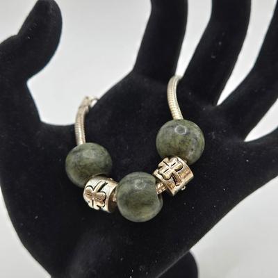 LOT 31: Beautiful Multi-Colored Bead Bracelet, Green Bead and Silver Shamrock Charm Bracelet, and Silver-tone Abalone Bracelet