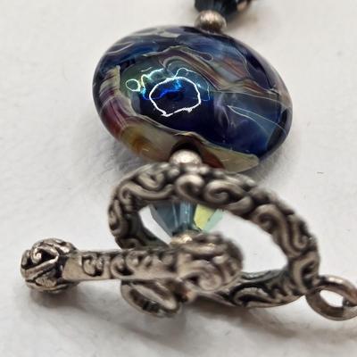 LOT 31: Beautiful Multi-Colored Bead Bracelet, Green Bead and Silver Shamrock Charm Bracelet, and Silver-tone Abalone Bracelet