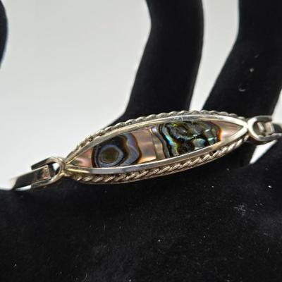 LOT 31: Beautiful Multi-Colored Bead Bracelet, Green Bead and Silver Shamrock Charm Bracelet, and Silver-tone Abalone Bracelet