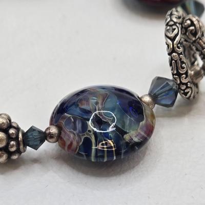 LOT 31: Beautiful Multi-Colored Bead Bracelet, Green Bead and Silver Shamrock Charm Bracelet, and Silver-tone Abalone Bracelet
