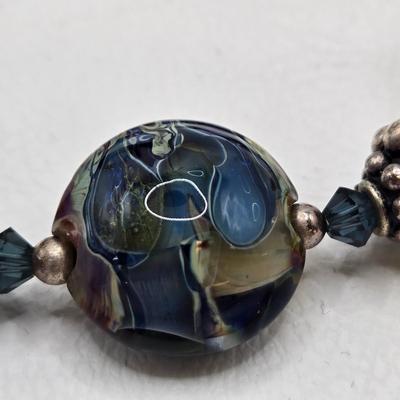 LOT 31: Beautiful Multi-Colored Bead Bracelet, Green Bead and Silver Shamrock Charm Bracelet, and Silver-tone Abalone Bracelet