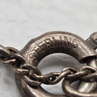 LOT 37: Jubilee Cross on 15 in. Trifari Chain, Religious Charm on 24 in. Silver Chain, Silver-tone and Turquoise Like Bead Rings, and More
