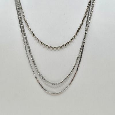 LOT 37: Jubilee Cross on 15 in. Trifari Chain, Religious Charm on 24 in. Silver Chain, Silver-tone and Turquoise Like Bead Rings, and More