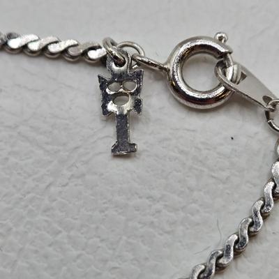 LOT 37: Jubilee Cross on 15 in. Trifari Chain, Religious Charm on 24 in. Silver Chain, Silver-tone and Turquoise Like Bead Rings, and More