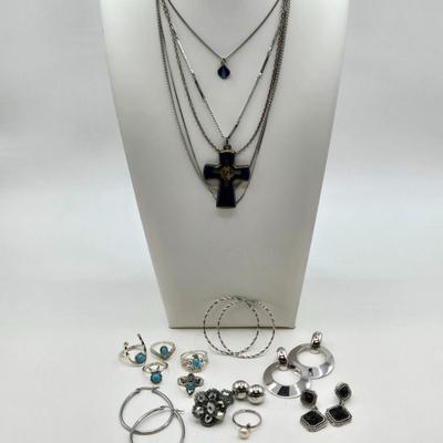 LOT 37: Jubilee Cross on 15 in. Trifari Chain, Religious Charm on 24 in. Silver Chain, Silver-tone and Turquoise Like Bead Rings, and More