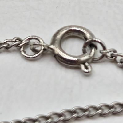 LOT 37: Jubilee Cross on 15 in. Trifari Chain, Religious Charm on 24 in. Silver Chain, Silver-tone and Turquoise Like Bead Rings, and More