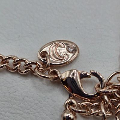 LOT 40: Gold-tone and Rose Colored Gemstone Necklace, Salmon Colored Necklace w/ Matching Earrings, 2 Bracelet and Earring Sets, and...