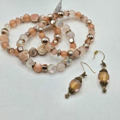 LOT 40: Gold-tone and Rose Colored Gemstone Necklace, Salmon Colored Necklace w/ Matching Earrings, 2 Bracelet and Earring Sets, and...