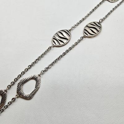 LOT 41: Multiple Black and Silver-tone Neclaces and Pair of Matching Earrings