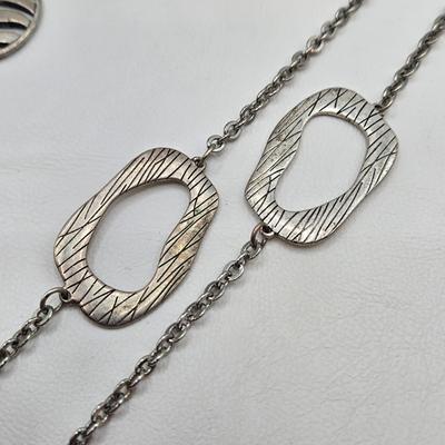 LOT 41: Multiple Black and Silver-tone Neclaces and Pair of Matching Earrings
