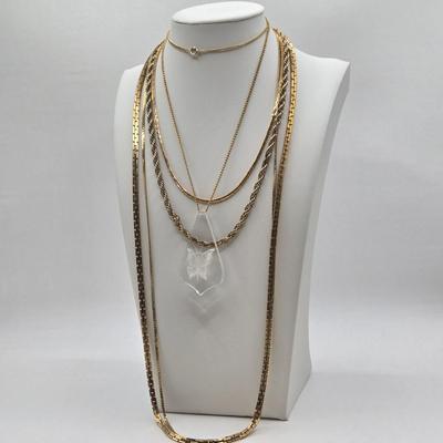 LOT 58: Five Gold-tone Chains/ One w/ Lucite Butterfly Pendant