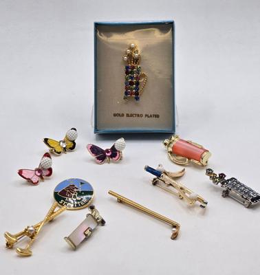 LOT 59: Multiple Golf Pins Including 12K Gold Filled Putter and Ball Pin