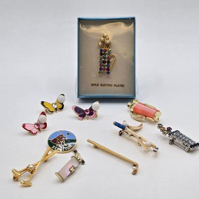 LOT 59: Multiple Golf Pins Including 12K Gold Filled Putter and Ball Pin