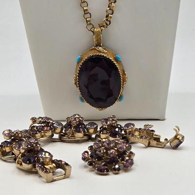 LOT 79: Capri Purple Art Glass Pendant Necklace, Two Tone Purple Rhinestone Bracelet w/ Safety Clasp, and One Matching Clip Earring
