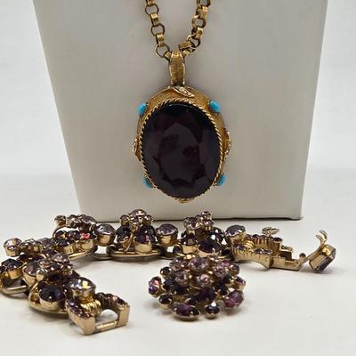 LOT 79: Capri Purple Art Glass Pendant Necklace, Two Tone Purple Rhinestone Bracelet w/ Safety Clasp, and One Matching Clip Earring