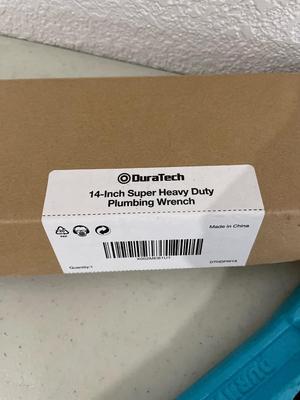 Plumbing wrench and torque gauge