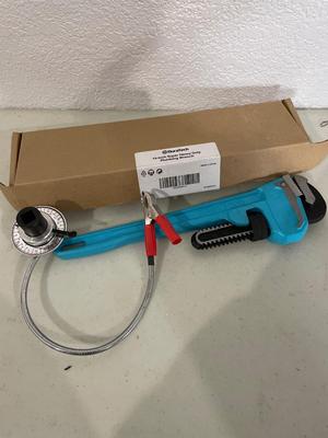 Plumbing wrench and torque gauge