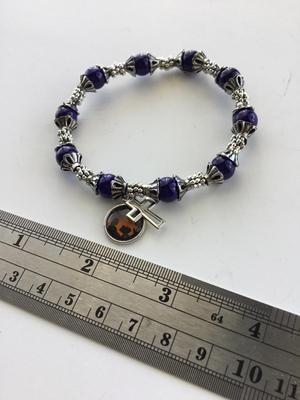 Unmarked blue stretchy cross charm bracelet