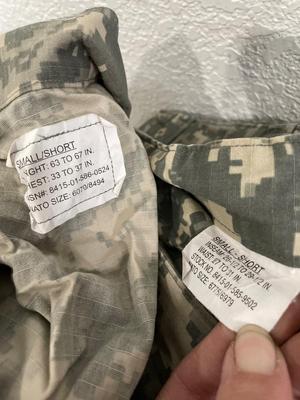 Army uniform with hats, shirts, and shorts