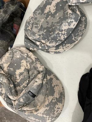 Army uniform with hats, shirts, and shorts