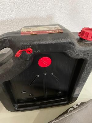 Gas can, oil container (fairly full) & mower bag