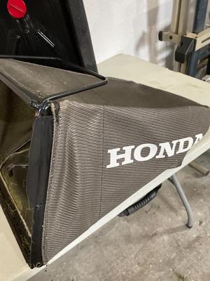 Gas can, oil container (fairly full) & mower bag